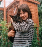 Our daughter Amy aged 10 with Artro Brown Brynbach, our former stud cat
